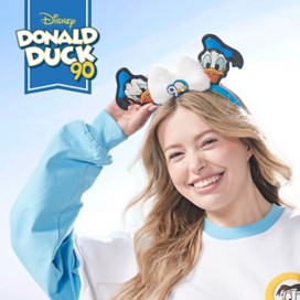 Woman wearing a spirit jersey featuring donald duck celebrating the 90th anniversary