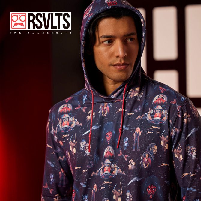 Young man wearing a RSVLTS hoodie with an all over Star Was: The Phantom Menace pattern.&nbsp;